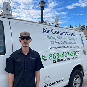 Adam standing in front of the Air Commanders van